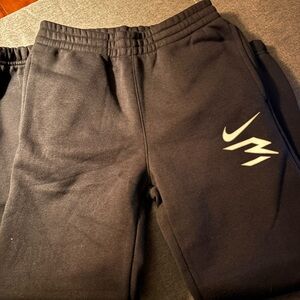 Nike Kids Black Joggers with White Swoosh and Graphic